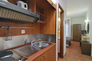A kitchen or kitchenette at Enalion Hotel