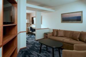 a living room with a couch and a table at Fairfield Inn and Suites San Bernardino in San Bernardino