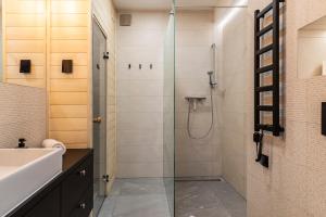 a bathroom with a shower and a sink at Apartament Czorsztyn in Kluszkowce +46 photos