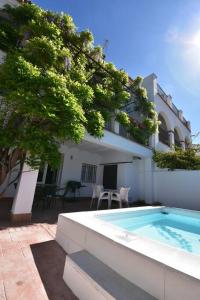 a house with a swimming pool next to a building at Casa Rural Almonaster la Real, Marques de Robledal in Almonaster la Real