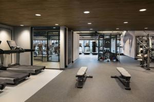 a gym with several treadmills and cardio machines at Santa Clara Marriott in Santa Clara