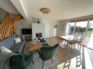 a living room with a couch and a table at Kivika in Lahe