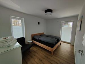 Postel nebo postele na pokoji v ubytování Ferienwohnung in Lütjenburg/Ostsee zu vermieten