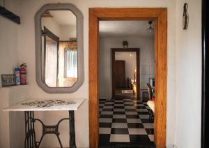 a hallway with a table and a mirror at Libling Štiavnický in Banská Štiavnica +51 photos