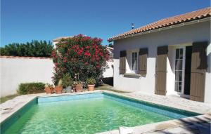 una piscina di fronte a una casa di Lovely Home In Les Angles With Private Swimming Pool, Can Be Inside Or Outside a Les Angles Gard