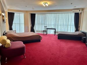 Postel nebo postele na pokoji v ubytování Mark Plaza Hotel