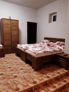 Postel nebo postele na pokoji v ubytování Helga Apartman
