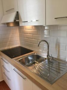 a kitchen with a sink and a stainless steel sink at DaLu Florence apartment Lucilla - private car park 15 minutes to the city center in Florence