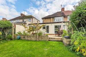 an exterior view of a house with a yard at Stunning three bedroom house with patio and garden in Preston