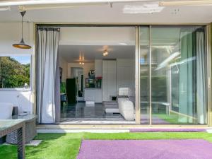 a glass extension of a house with a living room at Croisette pearl in Cannes