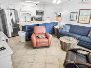 a kitchen with a couch and a chair and a table at IS9-Cozy Upstairs Beachfront Condo - King Beds in Fort Walton Beach