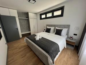 a bedroom with a large bed and a window at Crystal Apartments Old Town Sarajevo in Sarajevo