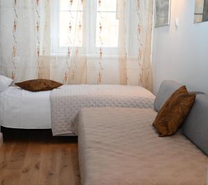 Postel nebo postele na pokoji v ubytování Old Town Apartment