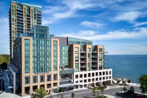 an aerial view of a building next to the ocean at The Pearle Hotel & Spa, Autograph Collection in Burlington