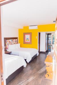 Postel nebo postele na pokoji v ubytování Hotel Posada El Rey Sol