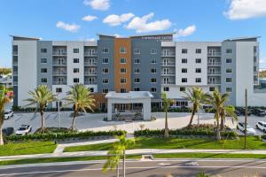 an image of a hotel with a parking lot at TownePlace Suites by Marriott Cape Canaveral Cocoa Beach in Cape Canaveral