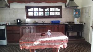 a kitchen with a table with a bowl on it at Casa Quinta in Colonia Caroya