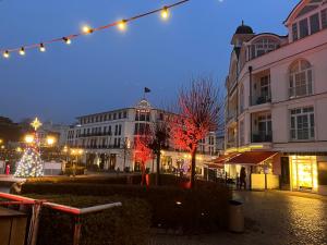 a city street at night with christmas lights at Fewo Elegance in Binz +24 photos