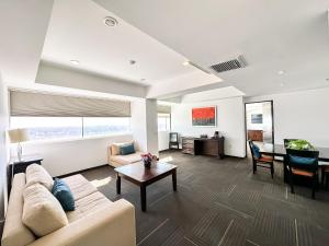 a living room with a couch and a table at Hotel Stadium in Le&oacute;n