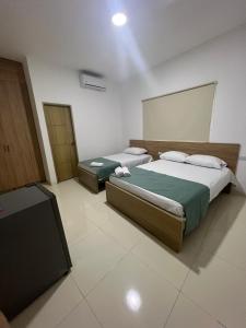 Katil atau katil-katil dalam bilik di Hotel Mariscales Sincelejo