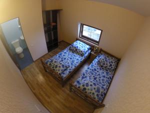 an overhead view of a living room with two beds at Glide Hostel in Yerevan