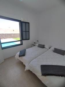 A bed or beds in a room at Villa Harena