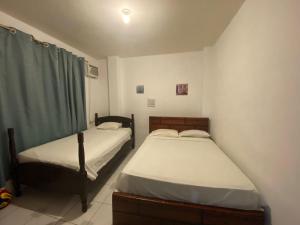 Кровать или кровати в номере Playa Aparts & Suites Malecon