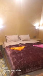 Postel nebo postele na pokoji v ubytování Hotel Riad Sahara Activity
