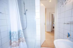 a bathroom with a shower and a sink at Wohnung-Ley in Dahme