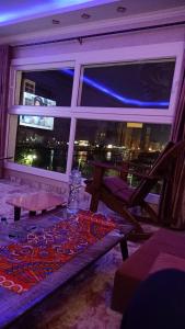 a room with a window with a view of the city at Nile Riviera in Mansoura in Mansoura