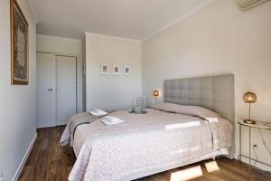 מיטה או מיטות בחדר ב-Casa dos Salgados