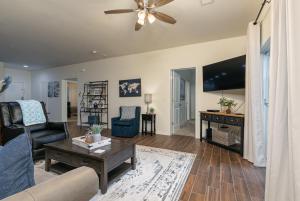 a living room with a couch and a tv at 3BR Walk-In - Close to Attractions - FREE TICKETS each day you stay - RL4-2 in Branson