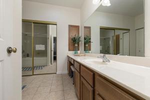 a bathroom with a sink and a large mirror at 3BR Walk-In - Close to Attractions - FREE TICKETS INCLUDED - RL4-2 in Branson +19 photos