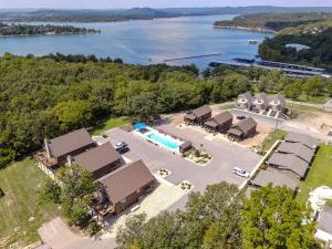 an aerial view of a resort with a pool and a lake at 4BD Lodge at Table Rock Lake - Near Marina - Pool - BBH in Lampe