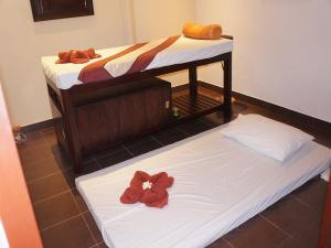 Katil atau katil-katil dalam bilik di The Oriental Tropical Beach at VIP Resort +25 gambar