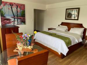 Voodi või voodid majutusasutuse Loreto hotel toas