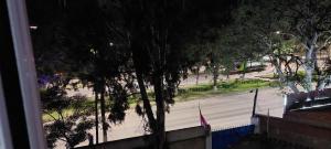 a view from a window of a street at night at Centro de Tarija departamento independiente completo in Tarija