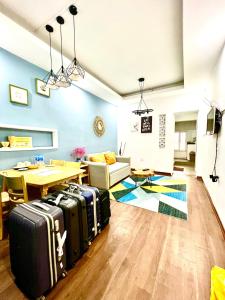 a living room with suitcases on the floor at Duplex WARM HANOI, 2 bedrooms, Old Quarter, 3mins to Hoan Kiem Lake in Hanoi