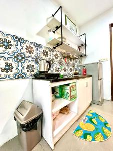 a kitchen with blue and white wallpaper on the wall at Duplex WARM HANOI, 2 bedrooms, Old Quarter, 3mins to Hoan Kiem Lake in Hanoi