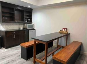 a kitchen with a table and a counter top at Big family getaway! can accommodate up to 14 guest in Abbotsford