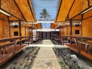 an inside view of a church with wooden benches at Dam Dam Hostel in San Vicente