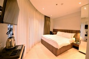 Postel nebo postele na pokoji v ubytování HOTEL ANUPAM RESIDENCY