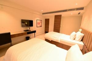 Postel nebo postele na pokoji v ubytování HOTEL ANUPAM RESIDENCY