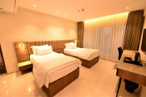 Postel nebo postele na pokoji v ubytování HOTEL ANUPAM RESIDENCY