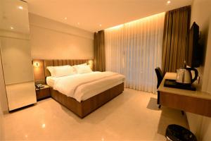 Postel nebo postele na pokoji v ubytování HOTEL ANUPAM RESIDENCY