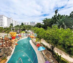 a pool at a resort with a lazy river at 5 Min Walk To Famous Blue Water Resort And Tourist Area in Maribago