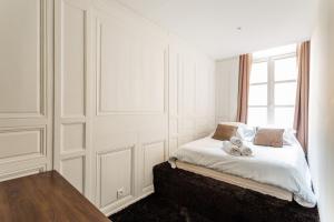 Łóżko lub łóżka w pokoju w obiekcie Appartement design au coeur de Rennes