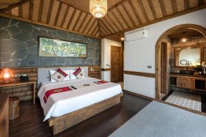 Postel nebo postele na pokoji v ubytování Sin Chai Ecolodge