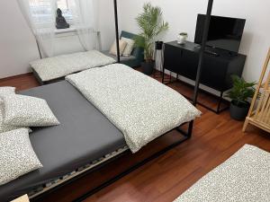 Postel nebo postele na pokoji v ubytování Sušilova 14 apartments I