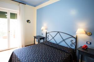 Postel nebo postele na pokoji v ubytování Hotel Sole